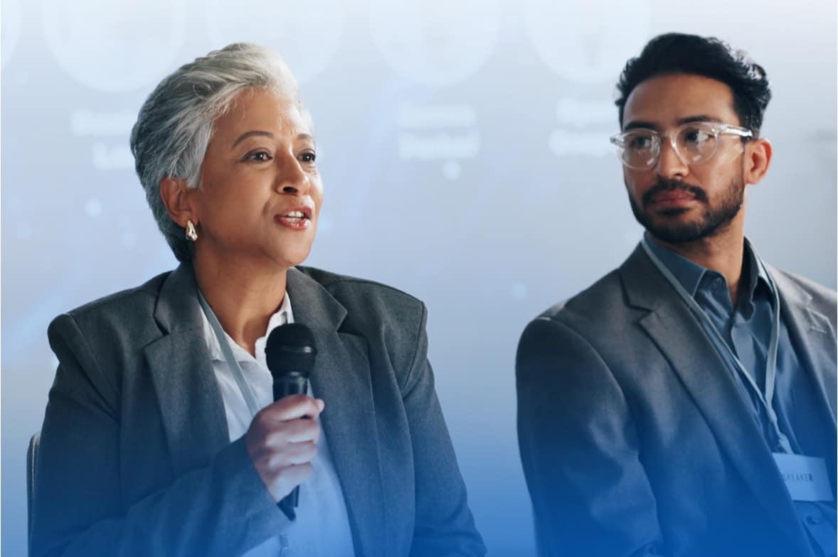 convening to act ncf cyber solutions strategy forum action meeting woman next to man speaks on conference stage