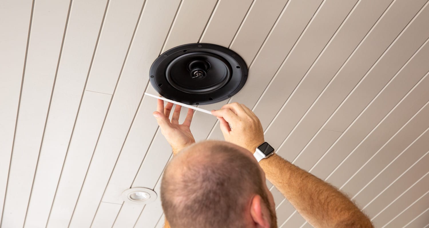 Ceiling-mounted speaker seamlessly integrated into a modern interior for high-quality audio distribution