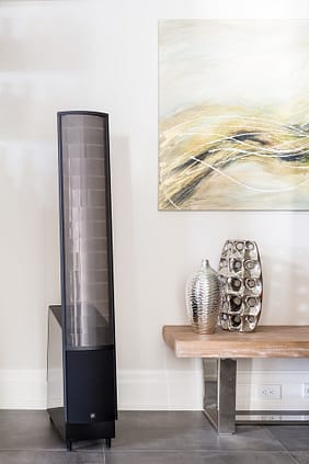 Martin Logan electrostatic speakers in a modern living room, providing high-fidelity sound with cutting-edge technology for an immersive listening experience.