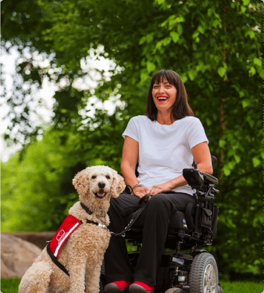 Woman in a wheelchair with her Service Dog Guide