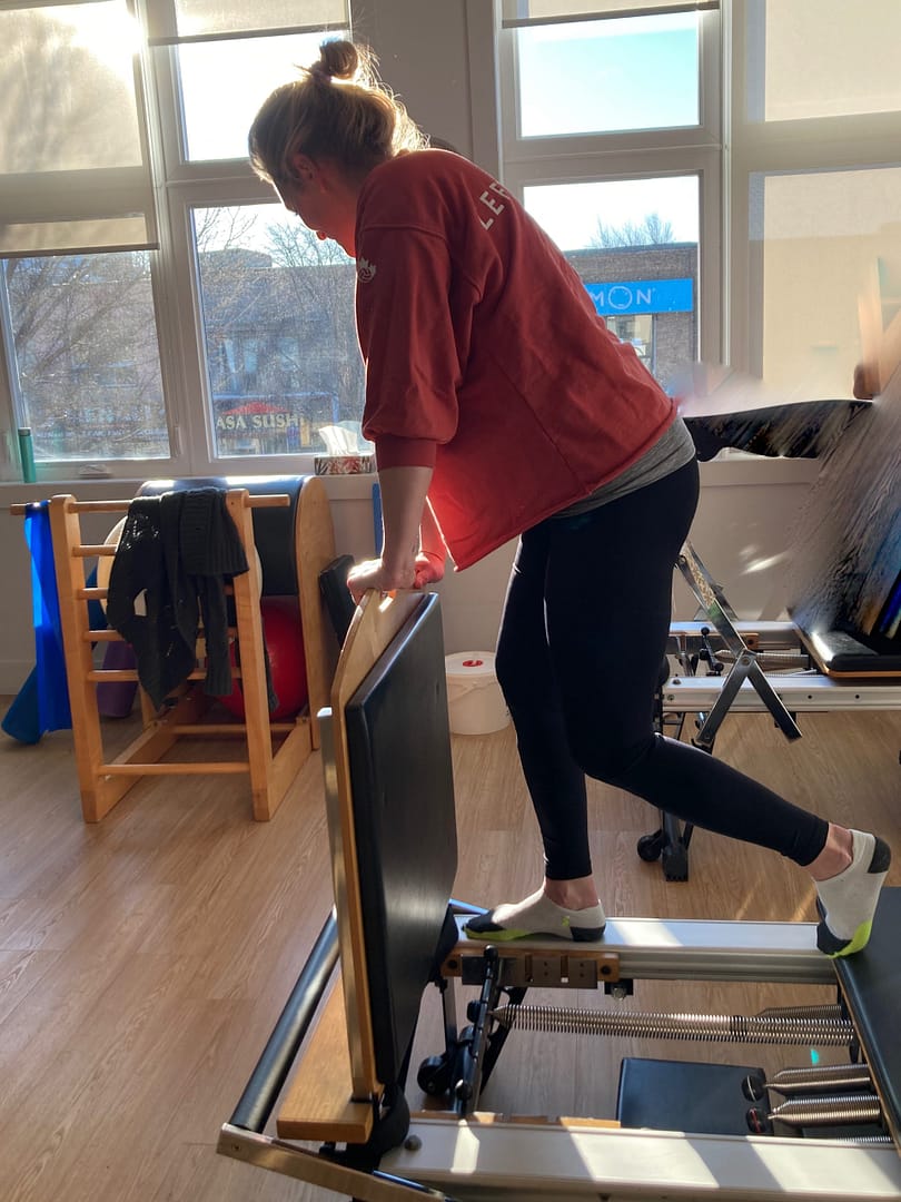 Hip Press on Pilates Reformer Demo of Hip Extension Exercise on Pilates Reformer
